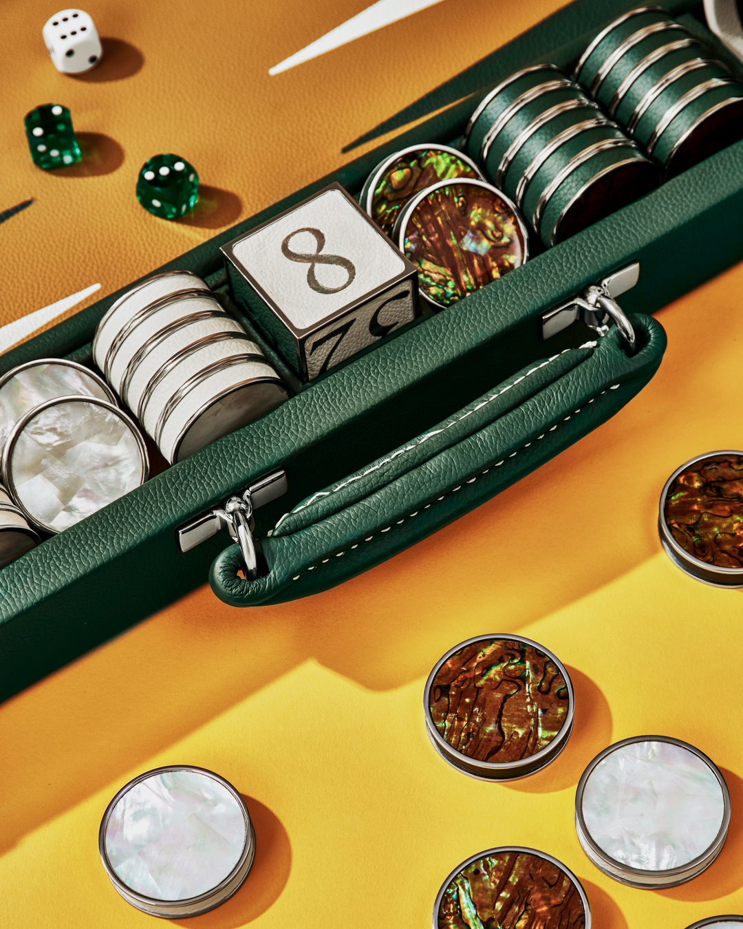 Abalone shell coasters on a yellow background