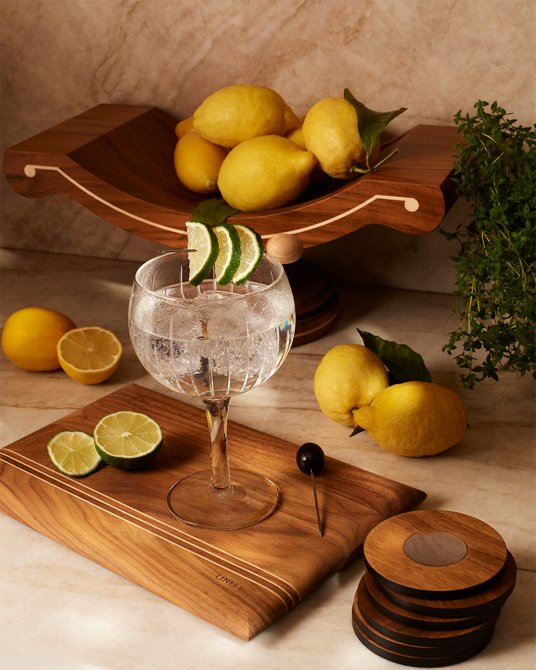 Cutting board with lemons and gin accessories