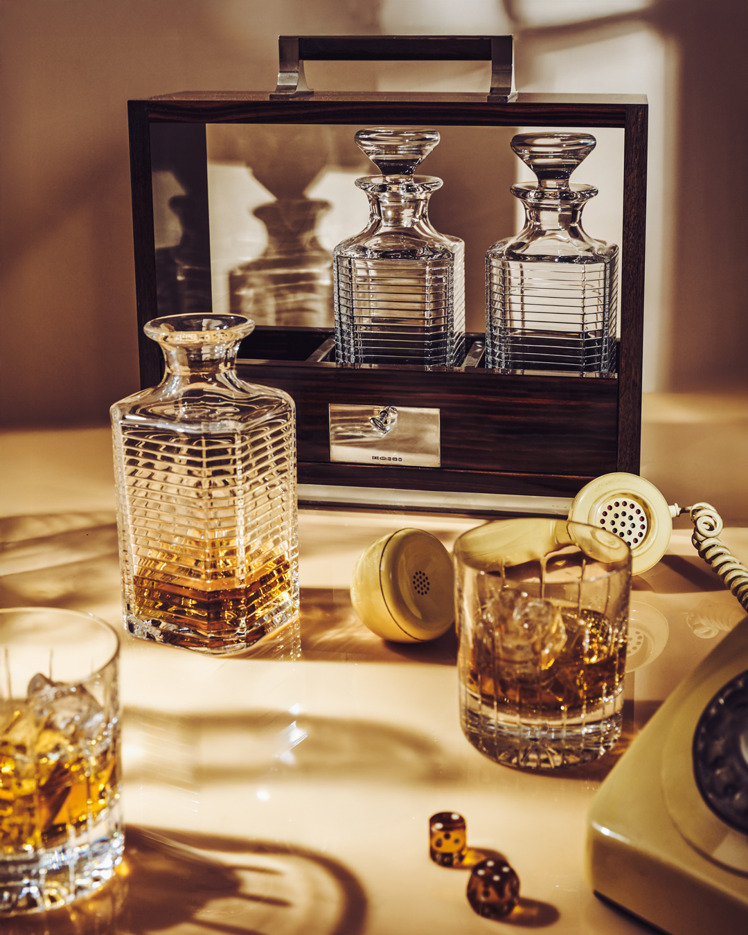 Triple tantalus with crystal decanters in a living space