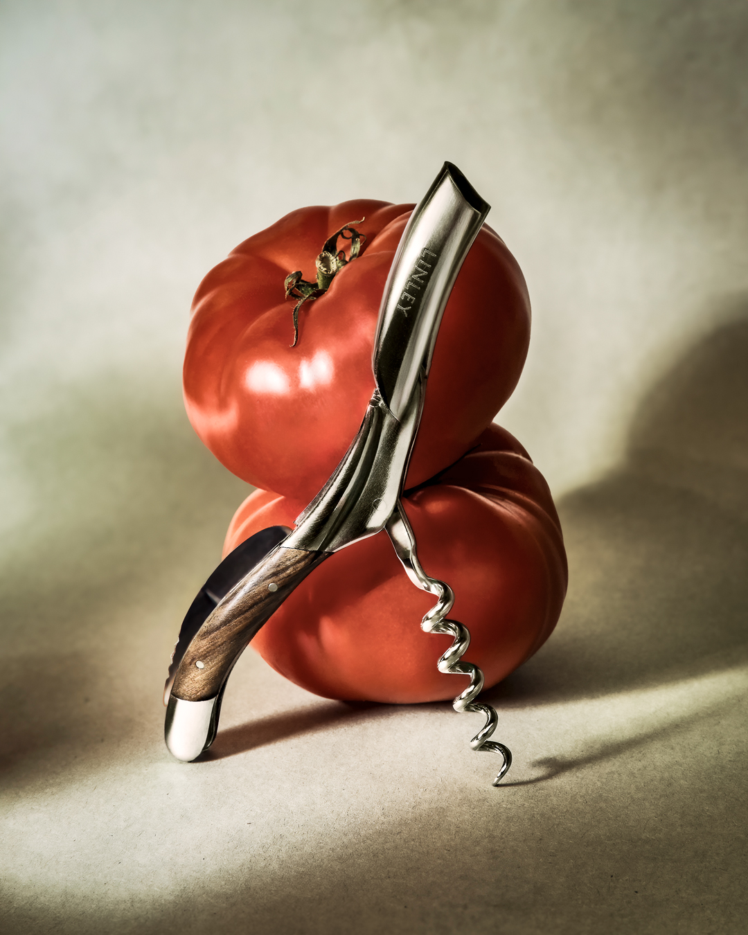 Tomato and corkscrew, editorial still life